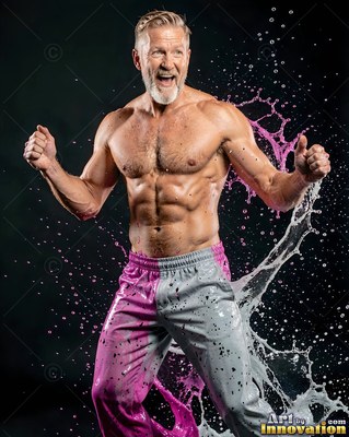 A shirtless older man shouting as pink water splashes
