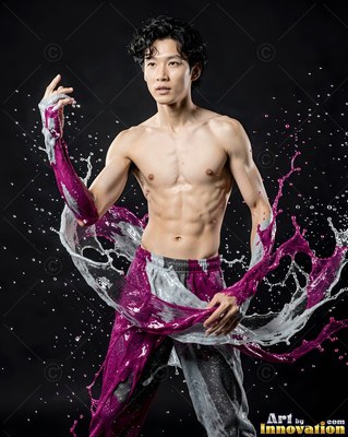 A shirtless man raises his arms, caught mid-splash in bright purple and white paint