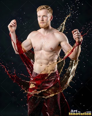 Shirtless man with red and gold liquid splashing around him