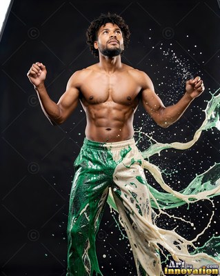 Man splashing green and white liquid from his pants