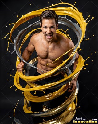 A shirtless smiling man is wrapped in loops of flying yellow and silver paint in a dark studio