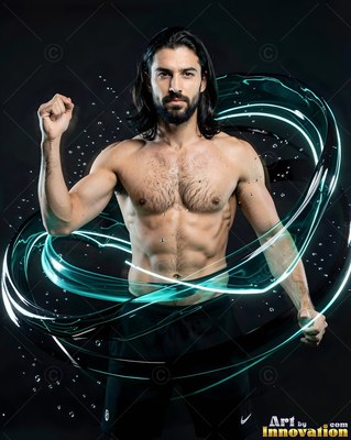 Shirtless man posing inside a circle of teal water splashes