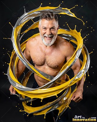 Smiling shirtless man ringed by swirls of silver and yellow paint