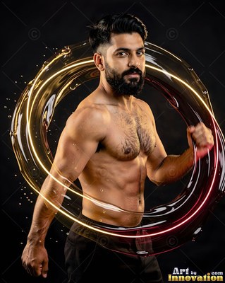 Tensing his muscles, a bearded man stands encircled by a ring of liquid glass