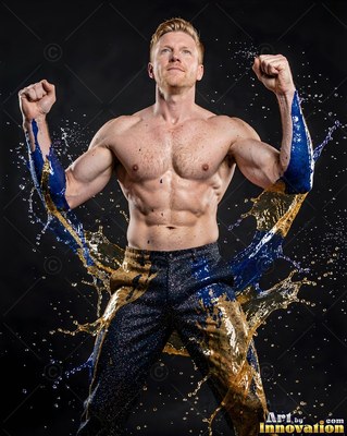 A shirtless man raises his fists with blue and gold liquid splashing