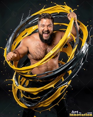 A shirtless bearded man shouts as thick spirals of glossy yellow and gray paint wrap around him
