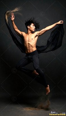 Bare-chested man in black leggings leaps midair inside a dark studio, holding flying black fabric
