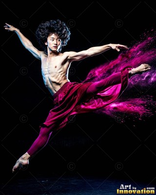 Man leaps in magenta pants with pink powder flying