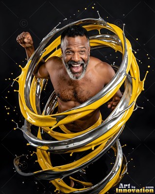 In a dark studio, a smiling bare-chested man is circled by yellow and silver liquid swirls