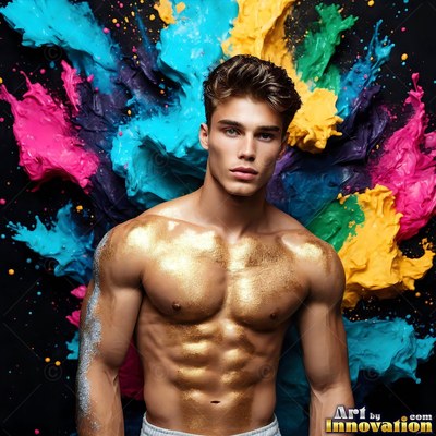 Posing shirtless, a man with gold dust on his chest stands before bursts of blue and yellow paint