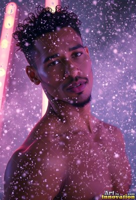 Curly black hair crowns a shirtless man standing in falling spray under pink light
