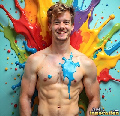 Blue paint splatters on a shirtless smiling man against colorful bursts of paint on a light blue wall