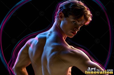 Against a black background, a shirtless man turns back toward pink and bright blue loops of light