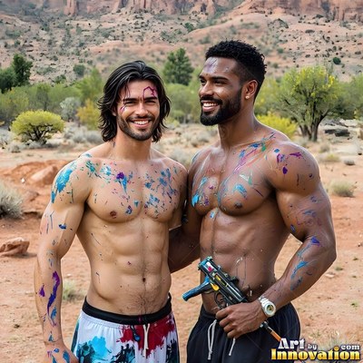 Two shirtless men covered in colorful paint smile together in a desert