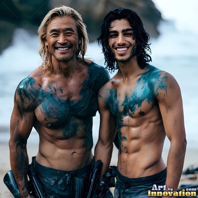 Dark green paint streaks across the chests of two smiling men standing on a beach under daylight