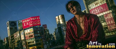 Above city streets, a young man has on an open red silk shirt by neon signs