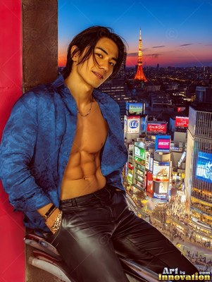 Man dressed in an open blue shirt sitting above Shibuya at dusk
