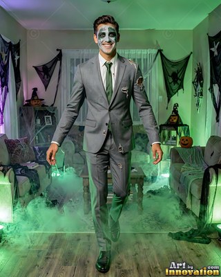 Man in a ripped gray suit and zombie makeup walking in green fog