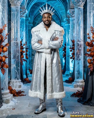 A man in a silver fur coat crosses his arms under cool blue lighting