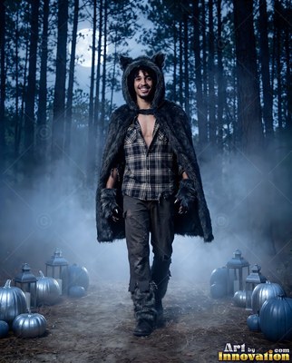 A man wearing a Halloween costume for men on a candlelit spooky set, posed to show off the outfit