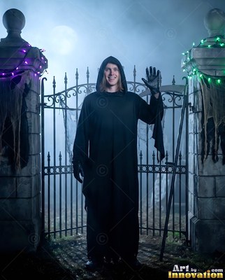 A man wearing a Halloween costume for men on a candlelit spooky set, posed to show off the outfit