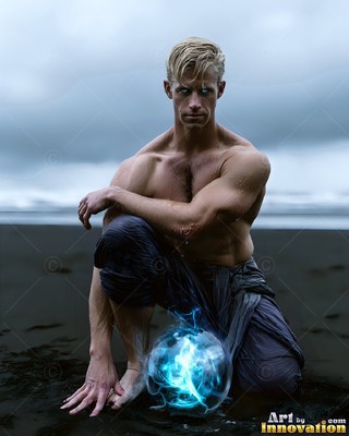 A shirtless man kneels on a dark beach near a blue energy orb