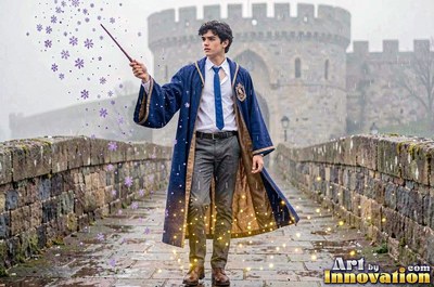 Standing on a stone castle bridge, a young man raises a wand in a blue robe