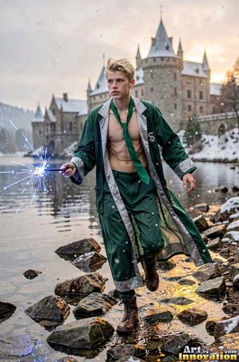 Walking forward by a snowy lake, a bare-chested young guy grips a sparkling wand