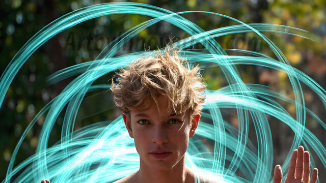 Abstract Male Art, AI photos of handsome shirtless men dancing with Light Rays, colorful art in motion. Guys dancing with radiant light rays that wrap around his body in flowing patterns, emphasizing his movements and adding a sense of ethereal fluidity. The designs appear weightless and almost sculptural, creates a striking contrast against the backgrounds making him the center of a cosmic dance, with energy and elegance. AI-generated abstract art HD photos featuring handsome, sexy, shirtless, men, boys, lads, dancing with colorful light rays, dynamic, interactive. Combining elements of realism with surreal abstract qualities, showcasing the potential of AI in artistic expression.