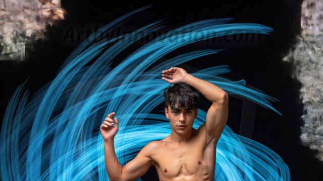 Abstract Male Art, AI photos of handsome shirtless men dancing with Light Rays, colorful art in motion. Guys dancing with radiant light rays that wrap around his body in flowing patterns, emphasizing his movements and adding a sense of ethereal fluidity. The designs appear weightless and almost sculptural, creates a striking contrast against the backgrounds making him the center of a cosmic dance, with energy and elegance. AI-generated abstract art HD photos featuring handsome, sexy, shirtless, men, boys, lads, dancing with colorful light rays, dynamic, interactive. Combining elements of realism with surreal abstract qualities, showcasing the potential of AI in artistic expression.