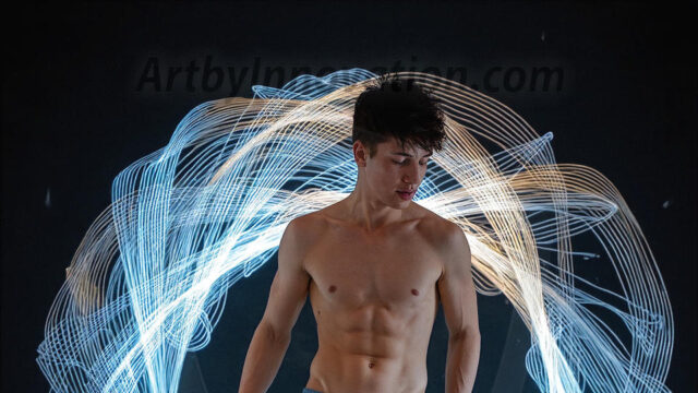 Abstract Male Art, AI photos of handsome shirtless men dancing with Light Rays, colorful art in motion. Guys dancing with radiant light rays that wrap around his body in flowing patterns, emphasizing his movements and adding a sense of ethereal fluidity. The designs appear weightless and almost sculptural, creates a striking contrast against the backgrounds making him the center of a cosmic dance, with energy and elegance. AI-generated abstract art HD photos featuring handsome, sexy, shirtless, men, boys, lads, dancing with colorful light rays, dynamic, interactive. Combining elements of realism with surreal abstract qualities, showcasing the potential of AI in artistic expression.