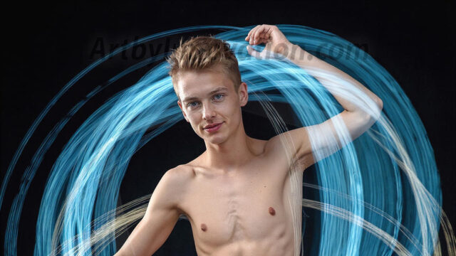 Abstract Male Art, AI photos of handsome shirtless men dancing with Light Rays, colorful art in motion. Guys dancing with radiant light rays that wrap around his body in flowing patterns, emphasizing his movements and adding a sense of ethereal fluidity. The designs appear weightless and almost sculptural, creates a striking contrast against the backgrounds making him the center of a cosmic dance, with energy and elegance. AI-generated abstract art HD photos featuring handsome, sexy, shirtless, men, boys, lads, dancing with colorful light rays, dynamic, interactive. Combining elements of realism with surreal abstract qualities, showcasing the potential of AI in artistic expression.