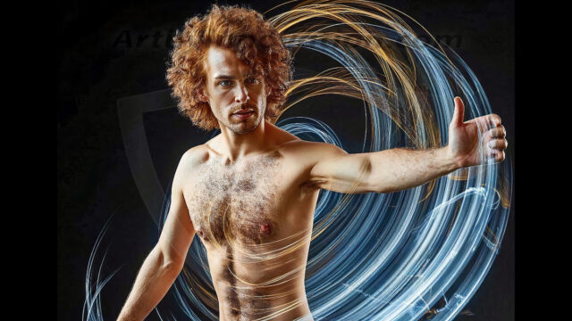 Abstract Male Art, AI photos of handsome shirtless men dancing with Light Rays, colorful art in motion. Guys dancing with radiant light rays that wrap around his body in flowing patterns, emphasizing his movements and adding a sense of ethereal fluidity. The designs appear weightless and almost sculptural, creates a striking contrast against the backgrounds making him the center of a cosmic dance, with energy and elegance. AI-generated abstract art HD photos featuring handsome, sexy, shirtless, men, boys, lads, dancing with colorful light rays, dynamic, interactive. Combining elements of realism with surreal abstract qualities, showcasing the potential of AI in artistic expression.