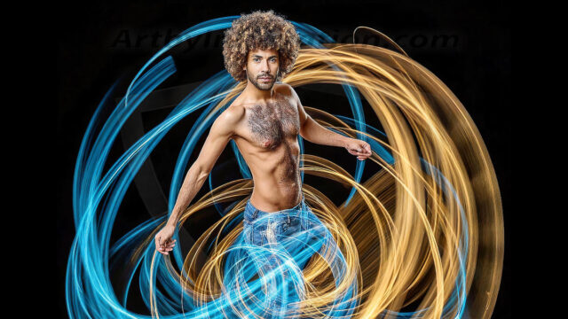 Abstract Male Art, AI photos of handsome shirtless men dancing with Light Rays, colorful art in motion. Guys dancing with radiant light rays that wrap around his body in flowing patterns, emphasizing his movements and adding a sense of ethereal fluidity. The designs appear weightless and almost sculptural, creates a striking contrast against the backgrounds making him the center of a cosmic dance, with energy and elegance. AI-generated abstract art HD photos featuring handsome, sexy, shirtless, men, boys, lads, dancing with colorful light rays, dynamic, interactive. Combining elements of realism with surreal abstract qualities, showcasing the potential of AI in artistic expression.