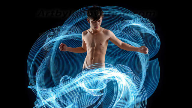 Abstract Male Art, AI photos of handsome shirtless men dancing with Light Rays, colorful art in motion. Guys dancing with radiant light rays that wrap around his body in flowing patterns, emphasizing his movements and adding a sense of ethereal fluidity. The designs appear weightless and almost sculptural, creates a striking contrast against the backgrounds making him the center of a cosmic dance, with energy and elegance. AI-generated abstract art HD photos featuring handsome, sexy, shirtless, men, boys, lads, dancing with colorful light rays, dynamic, interactive. Combining elements of realism with surreal abstract qualities, showcasing the potential of AI in artistic expression.