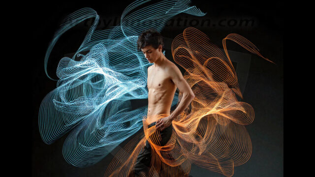 Abstract Male Art, AI photos of handsome shirtless men dancing with Light Rays, colorful art in motion. Guys dancing with radiant light rays that wrap around his body in flowing patterns, emphasizing his movements and adding a sense of ethereal fluidity. The designs appear weightless and almost sculptural, creates a striking contrast against the backgrounds making him the center of a cosmic dance, with energy and elegance. AI-generated abstract art HD photos featuring handsome, sexy, shirtless, men, boys, lads, dancing with colorful light rays, dynamic, interactive. Combining elements of realism with surreal abstract qualities, showcasing the potential of AI in artistic expression.