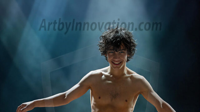 Abstract Male Art, AI photos of handsome shirtless men dancing with Light Rays, colorful art in motion. Guys dancing with radiant light rays that wrap around his body in flowing patterns, emphasizing his movements and adding a sense of ethereal fluidity. The designs appear weightless and almost sculptural, creates a striking contrast against the backgrounds making him the center of a cosmic dance, with energy and elegance. AI-generated abstract art HD photos featuring handsome, sexy, shirtless, men, boys, lads, dancing with colorful light rays, dynamic, interactive. Combining elements of realism with surreal abstract qualities, showcasing the potential of AI in artistic expression.