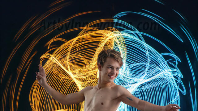 Abstract Male Art, AI photos of handsome shirtless men dancing with Light Rays, colorful art in motion. Guys dancing with radiant light rays that wrap around his body in flowing patterns, emphasizing his movements and adding a sense of ethereal fluidity. The designs appear weightless and almost sculptural, creates a striking contrast against the backgrounds making him the center of a cosmic dance, with energy and elegance. AI-generated abstract art HD photos featuring handsome, sexy, shirtless, men, boys, lads, dancing with colorful light rays, dynamic, interactive. Combining elements of realism with surreal abstract qualities, showcasing the potential of AI in artistic expression.