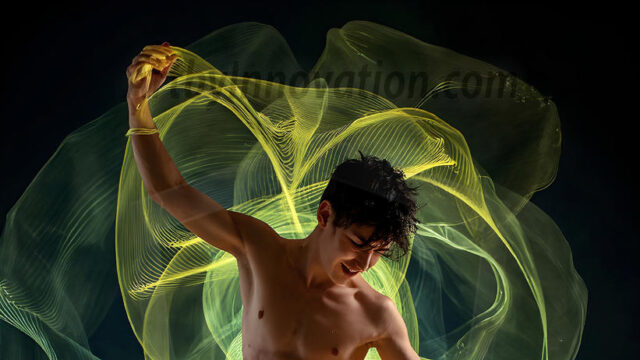 Abstract Male Art, AI photos of handsome shirtless men dancing with Light Rays, colorful art in motion. Guys dancing with radiant light rays that wrap around his body in flowing patterns, emphasizing his movements and adding a sense of ethereal fluidity. The designs appear weightless and almost sculptural, creates a striking contrast against the backgrounds making him the center of a cosmic dance, with energy and elegance. AI-generated abstract art HD photos featuring handsome, sexy, shirtless, men, boys, lads, dancing with colorful light rays, dynamic, interactive. Combining elements of realism with surreal abstract qualities, showcasing the potential of AI in artistic expression.