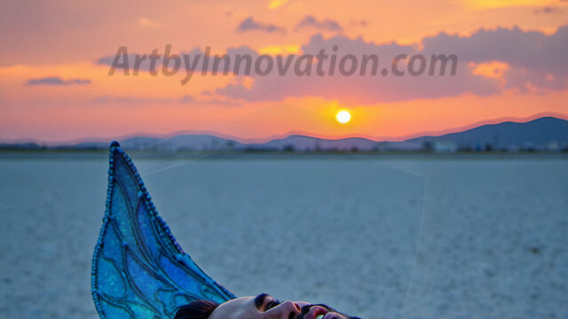 Brought to life through AI, Capturing the Pristine and Elusive Male Fairy. Imagine a realm where handsome shirtless men & boys possess enormous, shimmering crystal wings, vibrant and radiant, capturing and reflecting the light of the environment in a mesmerizing way, and adding a touch of mystery to their intense visage. Outdoors in a fantasy mysterious enchanted realm.