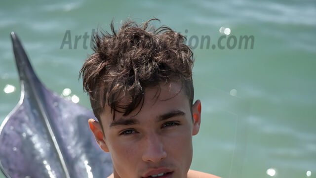 AI-generated HD photos featuring Mermen, The Warriors of the Sea. A collection of over 1,000 AI generated photo images of Mermen Warriors. Shirtless men from all age groups, with slim builds to hot and sexy, muscular body types, and from teenaged boys, to young men, to the handsome Elders. Merman warriors rising from a whirlpool, with a trident in hand, set against a stormy backdrop with dramatic lighting. Vibrant coral reefs, with detailed underwater scenes, highly realistic, with obsidian scales, that shimmer in the sunlight.