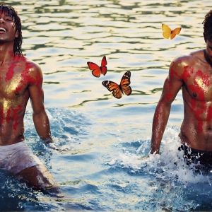 The Beautiful & Handsome Men Art Collection, A high-resolution photograph of two handsome best friends, half submerged in water, covered in body paint. Butterfly's flying about, as they spend time together, with a smile on their faces.