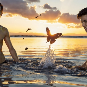 The Beautiful & Handsome Men Art Collection, A high-resolution photograph of two handsome best friends, half submerged in water, covered in body paint. Butterfly's flying about, as they spend time together, with a smile on their faces.
