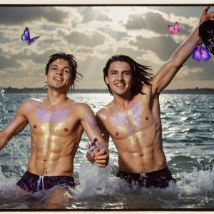 The Beautiful & Handsome Men Art Collection, A high-resolution photograph of two handsome best friends, half submerged in water, covered in body paint. Butterfly's flying about, as they spend time together, with a smile on their faces.