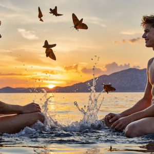 The Beautiful & Handsome Men Art Collection, A high-resolution photograph of two handsome best friends, half submerged in water, covered in body paint. Butterfly's flying about, as they spend time together, with a smile on their faces.