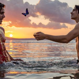 The Beautiful & Handsome Men Art Collection, A high-resolution photograph of two handsome best friends, half submerged in water, covered in body paint. Butterfly's flying about, as they spend time together, with a smile on their faces.
