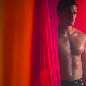 AI-generated art capturing men in a rainbow of colors creates a striking visual impact, blending surreal, vibrant, and high-fashion elements. Featuring artwork of beautiful, shirtless, muscular men embellished with or surrounded by a vibrant rainbow palette, evoking themes of pride, vitality, and artistic expression.