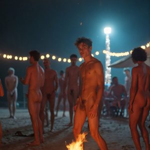 Bad Boys Naked Beach Party II. A full-body composition of a nude young man standing near a crackling bonfire, on a serene moonlit night at the beach. The gentle glow of the flames, flickers across his shinny wet body, catching his contours, and highlighting his muscular physique and handsome face. People everywhere partying, dancing to the music, having a good time together, naked, and free.