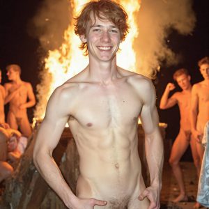 Bad Boys Naked Beach Party II. A full-body composition of a nude young man standing near a crackling bonfire, on a serene moonlit night at the beach. The gentle glow of the flames, flickers across his shinny wet body, catching his contours, and highlighting his muscular physique and handsome face. People everywhere partying, dancing to the music, having a good time together, naked, and free.